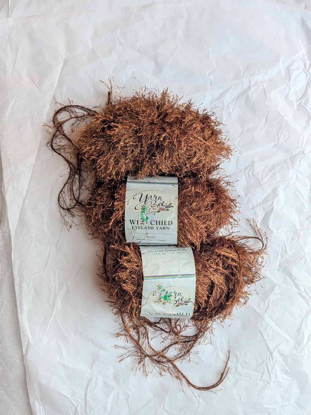 3 skeins of Yarn Bee Wild Child Eyelash yarn in the color 'pecan'